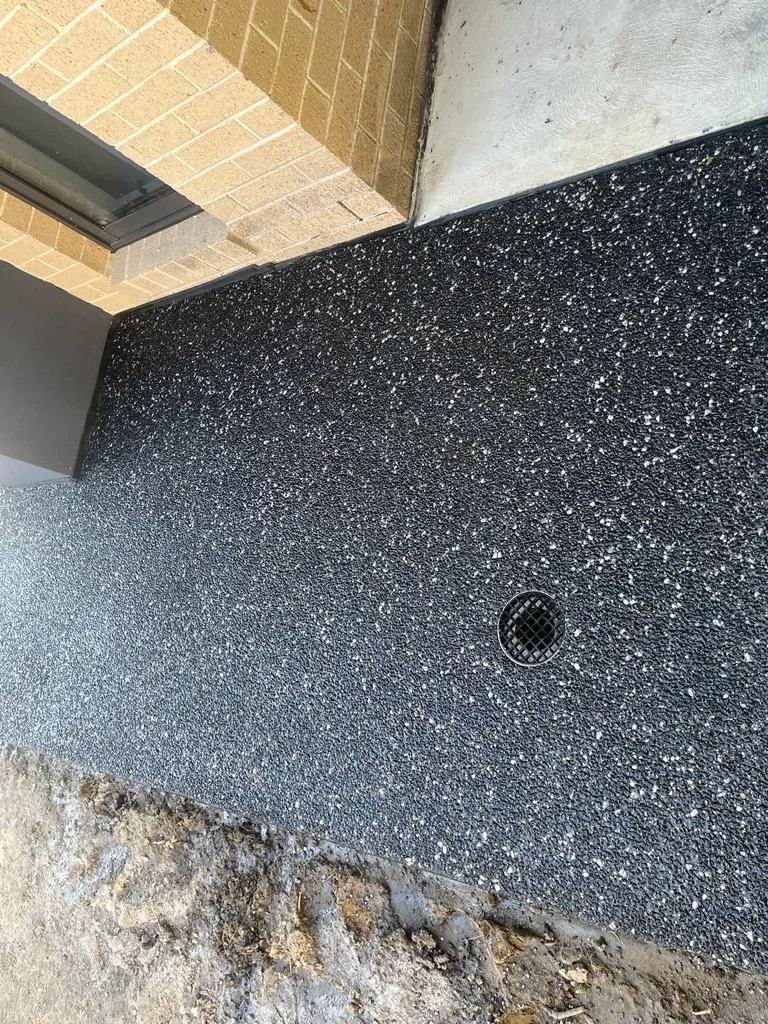 Exposed aggregate concrete driveway in Moorabbin with a textured, decorative surface