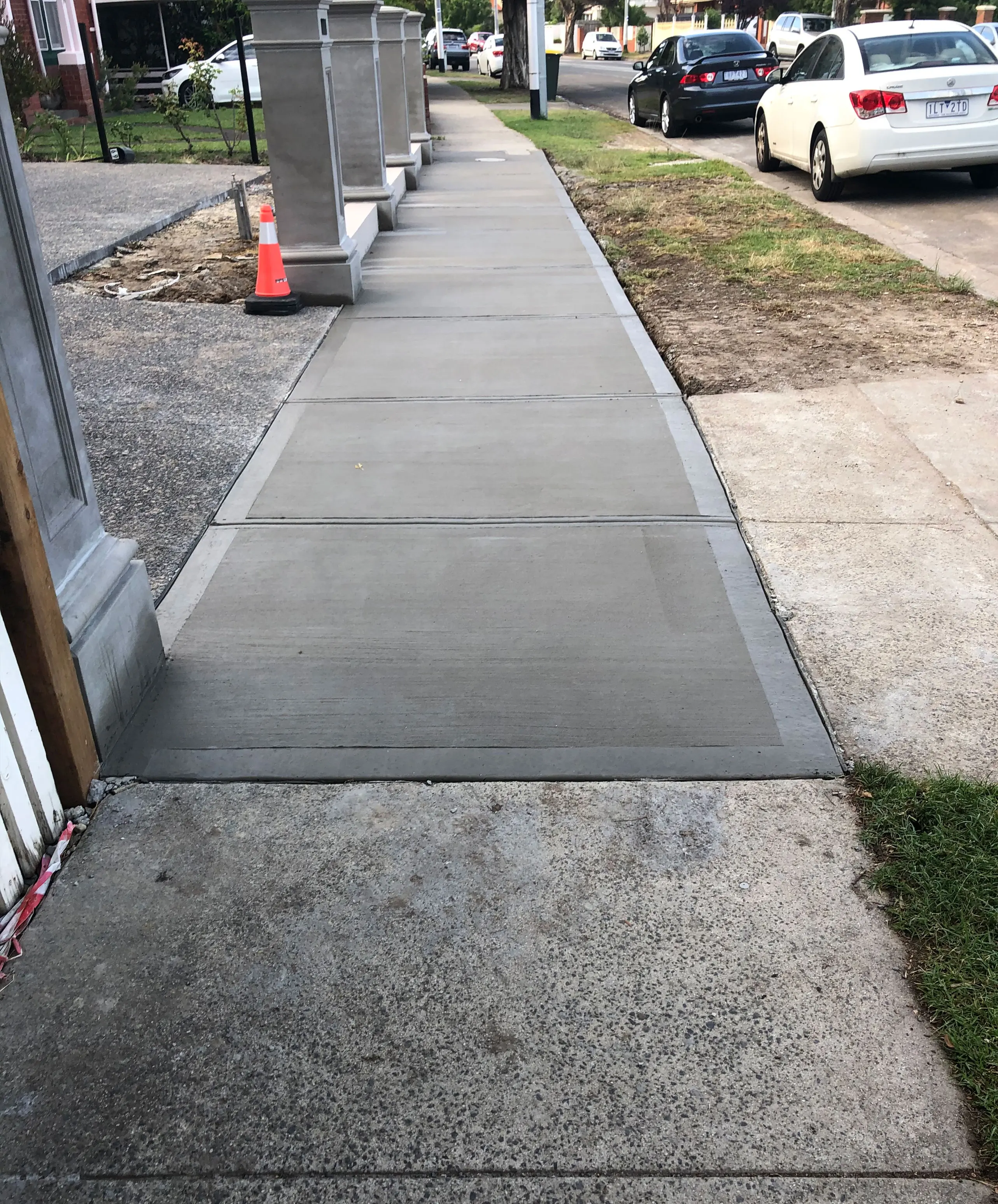 Concrete crossover in Noble Park connecting driveway to street